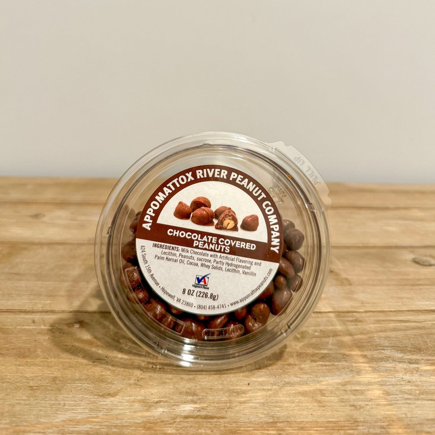 Chocolate covered peanuts 8 oz container.